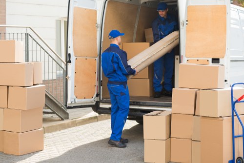 Van moving team preparing items safely before transport