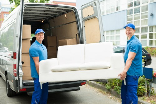 Mover carrying boxes with safety focus for Man With Van Finchley