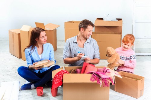 Student packing supplies for a Finchley move