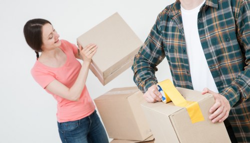 Local mover carrying furniture for a Finchley home move