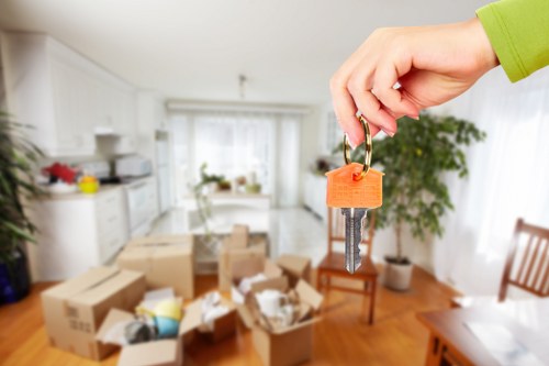 Moving boxes and furniture stacked for a load-based quote example