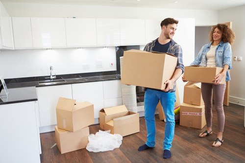 Packed boxes and furniture ready for a Finchley removal van