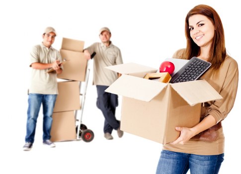 Loading furniture into a moving truck on a Finchley street
