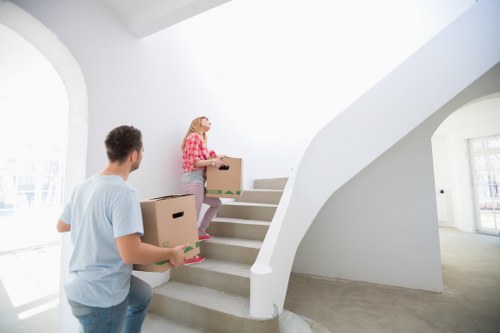 Local moving team transporting household items across Finchley