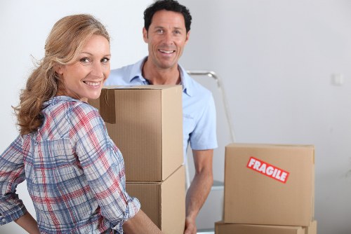 Professional movers loading items for a flat removal in Finchley